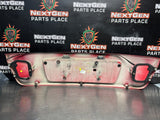 04-06 PONTIAC GTO LICENSE PLATE TRUNK FILLER PANEL TORRID RED OEM #1522