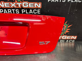 04-06 PONTIAC GTO LICENSE PLATE TRUNK FILLER PANEL TORRID RED OEM #1438