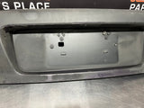 04-06 PONTIAC GTO LICENSE PLATE TRUNK FILLER PANEL OEM #784