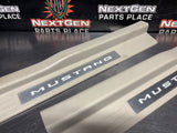 2011 FORD MUSTANG GT LH AND RH ILLUMINATED DOOR SILL TRIM SET TAN OEM #1494