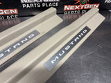 2011 FORD MUSTANG GT LH AND RH ILLUMINATED DOOR SILL TRIM SET TAN OEM #1494
