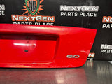 04-06 PONTIAC GTO LICENSE PLATE TRUNK FILLER PANEL TORRID RED OEM #1522