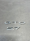 04-06 PONTIAC GTO LICENSE PLATE TRUNK FILLER PANEL GTO 5.7 BADGE EMBLEMS #164